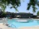 Gorgeous outdoor community pool with a large deck area and mature landscaping around the perimeter at 4026 Overcup Oak Ln, Cary, NC 27519