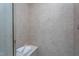 Tiled shower with built-in bench and recessed lighting, creating a spa-like experience at 4026 Overcup Oak Ln, Cary, NC 27519