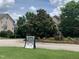Pool party advertisement with a well-maintained lawn, landscaping, and neighborhood homes in the background at 4026 Overcup Oak Ln, Cary, NC 27519