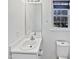Clean and bright bathroom features a white vanity, toilet and a window with natural light at 4507 Lazyriver Dr, Durham, NC 27712