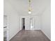 Upstairs bedroom with neutral walls, new carpet, and a ceiling fan at 4507 Lazyriver Dr, Durham, NC 27712