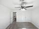 Spacious upstairs bedroom featuring a fan, double door closet, and new carpet at 4507 Lazyriver Dr, Durham, NC 27712