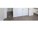Second story hallway with neutral carpet and a storage closet at 4507 Lazyriver Dr, Durham, NC 27712