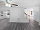 Open-concept floor plan with hardwood flooring, a modern staircase, and natural light at 4507 Lazyriver Dr, Durham, NC 27712