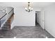 Bright living room with modern floors, neutral walls, and a decorative chandelier at 4507 Lazyriver Dr, Durham, NC 27712