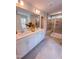 Bathroom with double sinks, white cabinets, and large mirror plus a walk-in shower at 452 Duncan Creek Rd # 156, Lillington, NC 27546