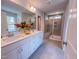 Bathroom with double sinks, white cabinets, and large mirror plus a walk-in shower at 452 Duncan Creek Rd # 156, Lillington, NC 27546