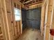 Unfinished bathroom with stud walls and a window, ready for customization at 452 Duncan Creek Rd # 156, Lillington, NC 27546