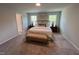 Large primary bedroom with neutral carpet and natural light at 452 Duncan Creek Rd # 156, Lillington, NC 27546