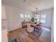 Bright dining room area with modern lighting and a view of the landscaped backyard at 452 Duncan Creek Rd # 156, Lillington, NC 27546