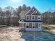 New two-story home with gray siding, white trim, and traditional architectural details at 452 Duncan Creek Rd # 156, Lillington, NC 27546