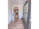 Inviting foyer featuring wood flooring, modern lighting, and paneled walls at 452 Duncan Creek Rd # 156, Lillington, NC 27546