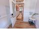 Inviting foyer showcasing an open doorway, modern lighting, and paneled walls at 452 Duncan Creek Rd # 156, Lillington, NC 27546