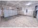Spacious two car garage with white walls and concrete floor at 452 Duncan Creek Rd # 156, Lillington, NC 27546