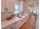 Kitchen area featuring white cabinets, quartz countertops, and a view to the dining area at 452 Duncan Creek Rd # 156, Lillington, NC 27546