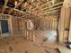 Unfinished living room featuring wood-framed walls and staircase at 452 Duncan Creek Rd # 156, Lillington, NC 27546