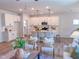 Bright living room showcases an open concept design with a kitchen and center island at 452 Duncan Creek Rd # 156, Lillington, NC 27546