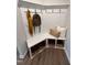 Angle view of mudroom with white trim and storage for shoes and coats at 452 Duncan Creek Rd # 156, Lillington, NC 27546
