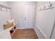 Bright mudroom with white storage bench, hooks and neutral decor perfect for any Gathering at 452 Duncan Creek Rd # 156, Lillington, NC 27546