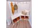 Mudroom with bright white trim, storage bench, baskets and lots of storage space at 452 Duncan Creek Rd # 156, Lillington, NC 27546