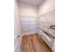 Walk-in pantry with metal shelving and wooden floors at 452 Duncan Creek Rd # 156, Lillington, NC 27546