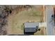 Aerial view of a home with large yard offering space and privacy, perfect for outdoor activities and future enhancements at 507 Southwick Pl, Mebane, NC 27302