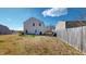 Spacious backyard enclosed by a wooden fence, offering privacy and room for recreation and outdoor activities at 507 Southwick Pl, Mebane, NC 27302