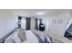 Bedroom featuring neutral decor, a plush bed, and a dedicated workspace by the window at 507 Southwick Pl, Mebane, NC 27302