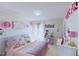 Bright bedroom features a comfortable bed, canopy and decorated with colorful, whimsical decor at 507 Southwick Pl, Mebane, NC 27302