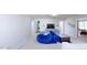 Bonus room featuring a blue beanbag couch and an entertainment center at 507 Southwick Pl, Mebane, NC 27302
