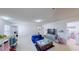 Bonus room features a large entertainment center, blue beanbag couch and views into other rooms at 507 Southwick Pl, Mebane, NC 27302