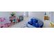 Bonus room with a beanbag chair, a play area, and access to a bathroom at 507 Southwick Pl, Mebane, NC 27302
