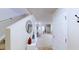 Bright foyer featuring a staircase, white walls, decorative mirror, and access to living areas at 507 Southwick Pl, Mebane, NC 27302