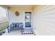 Inviting front porch with a bench, pillows, a 'welcome' mat and decorative door at 507 Southwick Pl, Mebane, NC 27302