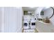Modern laundry room featuring a washing machine, dryer, and sleek shelving at 507 Southwick Pl, Mebane, NC 27302