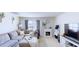 Bright living room with a comfortable sectional couch, fireplace and large window at 507 Southwick Pl, Mebane, NC 27302