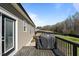 The back deck provides a great area to grill with plenty of wooded area behind the home at 511 Mcarthur Rd, Broadway, NC 27505