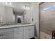 Bright bathroom features double sinks, granite countertop and a tile shower with glass door at 511 Mcarthur Rd, Broadway, NC 27505