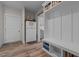 Inviting entryway with light-colored cabinets, coat rack, vinyl floors and an adjacent refrigerator at 511 Mcarthur Rd, Broadway, NC 27505