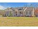 Charming single-story home with inviting front porch and manicured landscaping at 511 Mcarthur Rd, Broadway, NC 27505