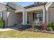 Inviting front porch with classic columns and comfortable seating at 511 Mcarthur Rd, Broadway, NC 27505