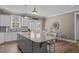 Spacious eat-in kitchen with a large island, stainless steel appliances, and hardwood floors at 511 Mcarthur Rd, Broadway, NC 27505