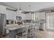 Bright and modern kitchen with granite countertops, stainless steel appliances, and breakfast bar seating at 511 Mcarthur Rd, Broadway, NC 27505