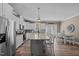 Bright and airy kitchen features white cabinets, granite countertops, and stainless steel appliances at 511 Mcarthur Rd, Broadway, NC 27505