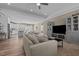 Open-concept living room flowing into kitchen and dining areas, perfect for entertaining at 511 Mcarthur Rd, Broadway, NC 27505