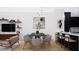 Open dining area featuring modern lighting, a dining table, and stylish decor at 512 Gordon St # 404, Durham, NC 27701