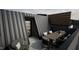 Outdoor rooftop terrace with a dining table and seating, perfect for entertaining at 512 Gordon St # 404, Durham, NC 27701