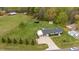 Stunning aerial view of the home with expansive lawn, gazebo, and outbuildings at 5121 Leesville Rd, Durham, NC 27703
