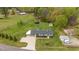 Aerial view of property showcasing the house, gazebo, outbuildings, and expansive yard at 5121 Leesville Rd, Durham, NC 27703