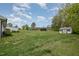 Expansive backyard featuring a gazebo, outbuilding, and ample green space at 5121 Leesville Rd, Durham, NC 27703